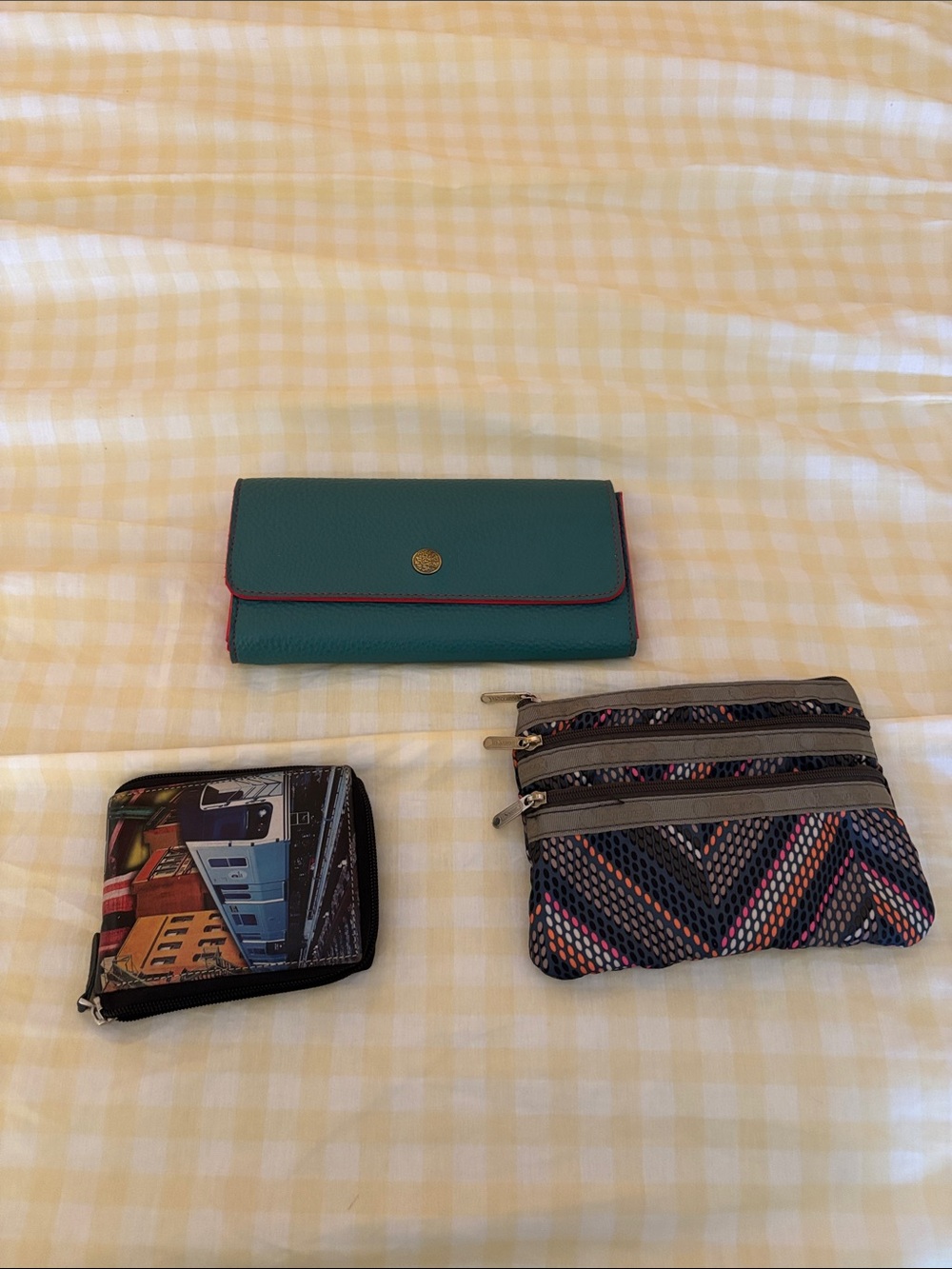 All three purses for $45 le sportsac, teal leather foldover and NYC billfold